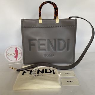 Fendi Medium Sunshine Shopper bag Gray leather with heat-stamped “FENDI ROMA” Stiff Tortoiseshell Plexiglass Handles. Made in Italy.