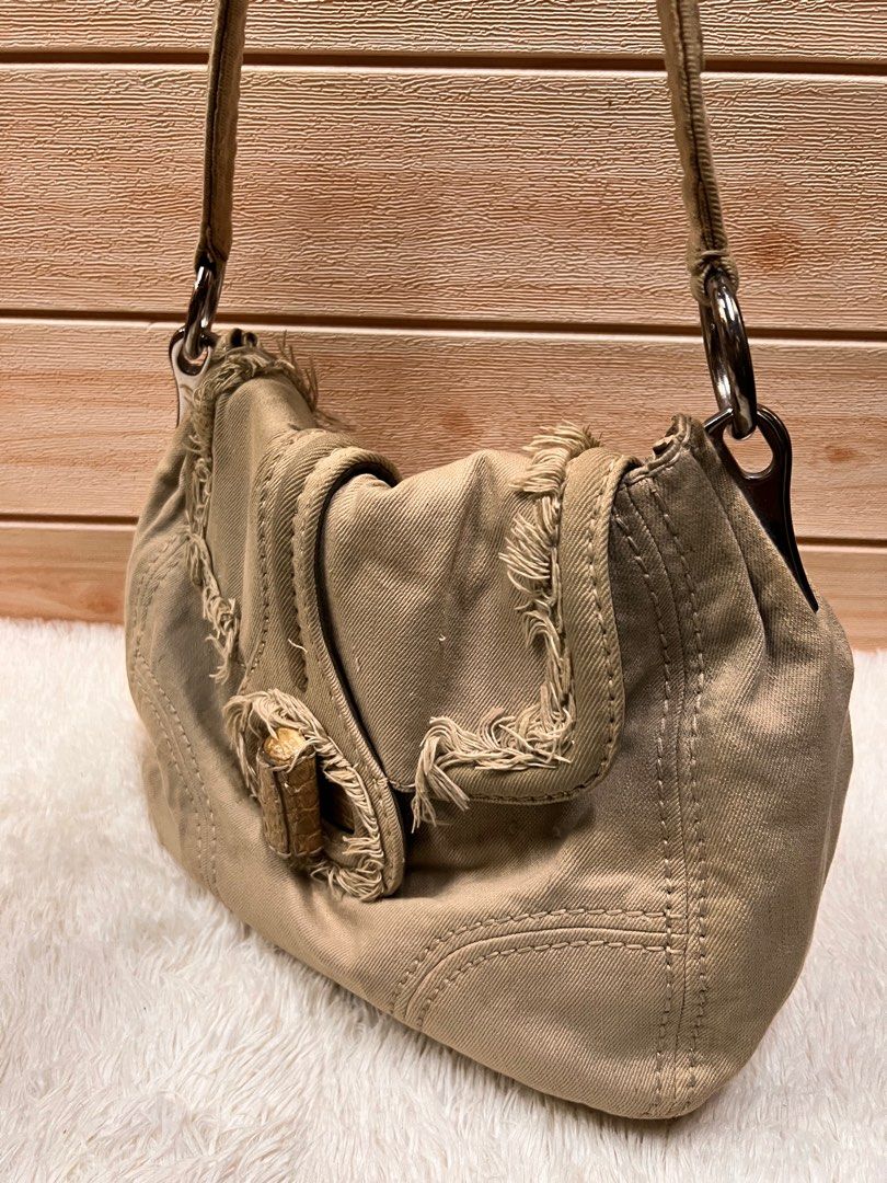 Authentic Prada Denim Shoulder Bag (Category: Luxury Bags & Wallets) located in Cagayan de Oro. Submitted by riggstuffs (Listing ID 1221250536, Image 3). Description: Guaranteed Authentic Prada Denim Shoulder Bag Made in Italy With white tag Exterior is made of denim material, no rubs or rips at each corner Interior has some pen marks Rank A-AB Disclaimer: Riggstuffs is not affiliated or associated with the brand posted. All trademarks and copyri