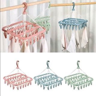 ￼baby hanger Plastic Laundry Hanger with Clips, Foldable Clip Hangers with 32 Clips, Windproof Hook