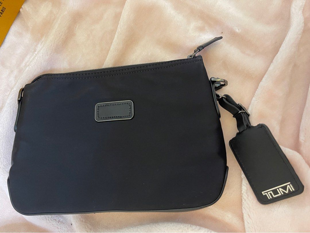 Tumi online clutch man