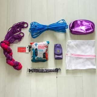 TRAVEL STUFF SET: WANDERSKYE BACKPACK COVER (DESIGNED BY FILIPINO ARTISTS), PURPLE PINK HAMMOCK DUYAN, PARACORD BRACELET WITH WHISTLE plus FREE CLOTHING LINE WITH HOOKS, CRUMPLER THE WINKLER BELT POUCH BAG, LAUNDRY BAG & PURPLE TOILETRIES POUCH