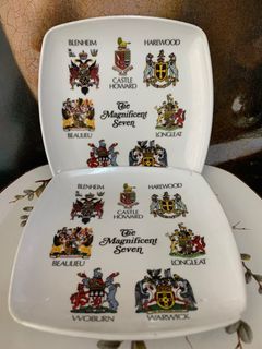 Vintage pair of Magnificent Seven Family Crest Dish Treasure Houses of Britain England. Made In Italy .