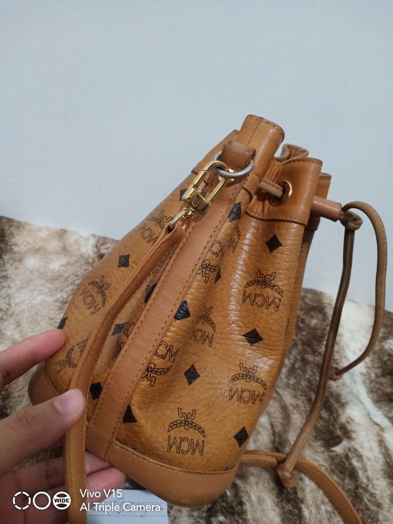 MCM mini bucket (Category: Luxury Bags & Wallets) located in Tagum. Submitted by luxbagelyas (Listing ID 1221317535, Image 3). Description: with sign of use may kunting faded s body and hardwares rubs sa leather part matibay.