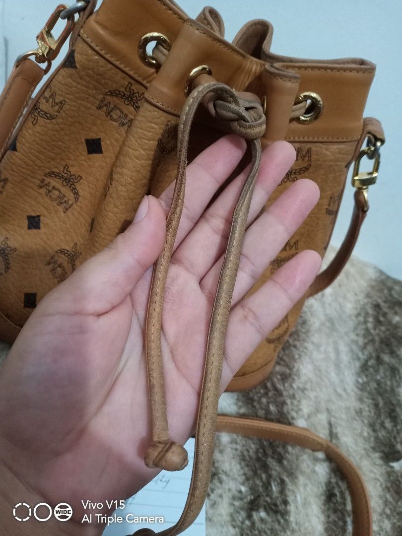 MCM mini bucket (Category: Luxury Bags & Wallets) located in Tagum. Submitted by luxbagelyas (Listing ID 1221317535, Image 2). Description: with sign of use may kunting faded s body and hardwares rubs sa leather part matibay.