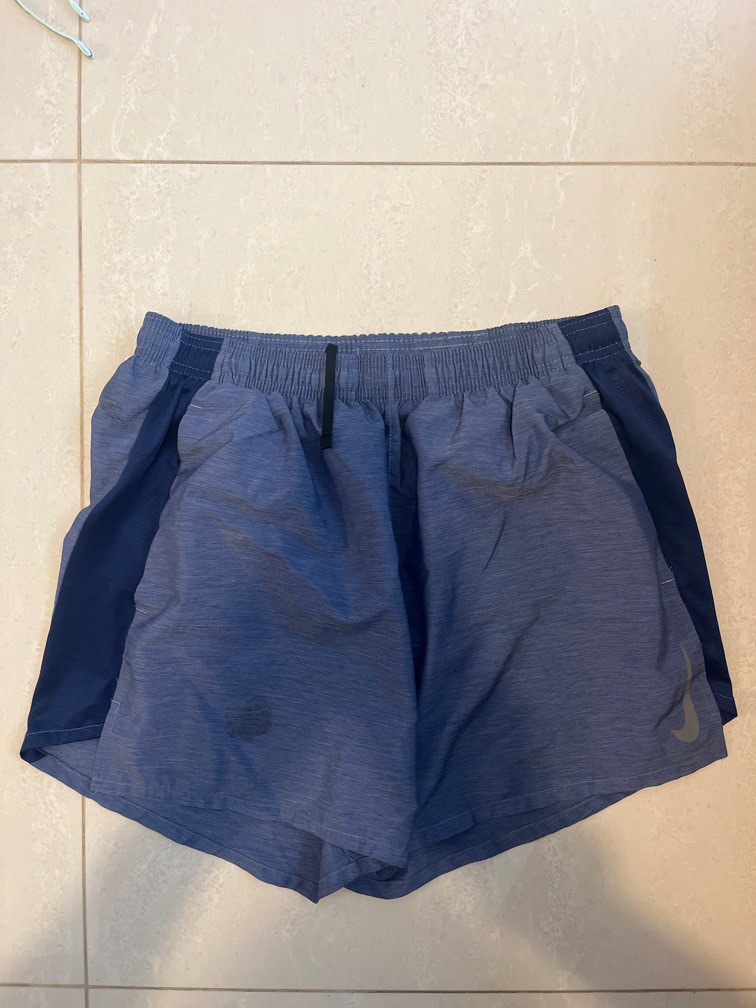 nike running blue ribbon sport logo shorts in blue