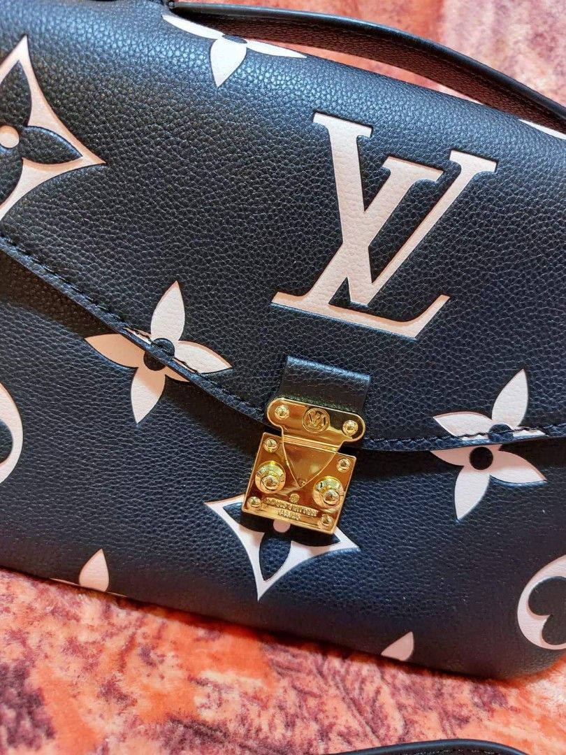 Preloved Lv metes embossed black& white (Category: Luxury Bags & Wallets) located in Cebu City. Submitted by day.98 (Listing ID 1221381447, Image 2). Description: selected from japan surplus no flaws coded genuine leather with dust bag meduim size.