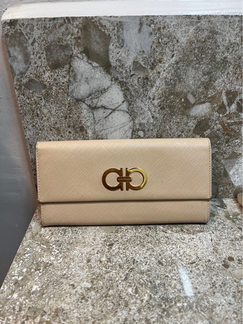 Salvatore Ferragamo Long Wallet (Category: Luxury Bags & Wallets) located in Mandaluyong City. Submitted by kqloset (Listing ID 1221322217, Image 1). Description: With 10 card slots, 1 zip compartment, 4 large slots.