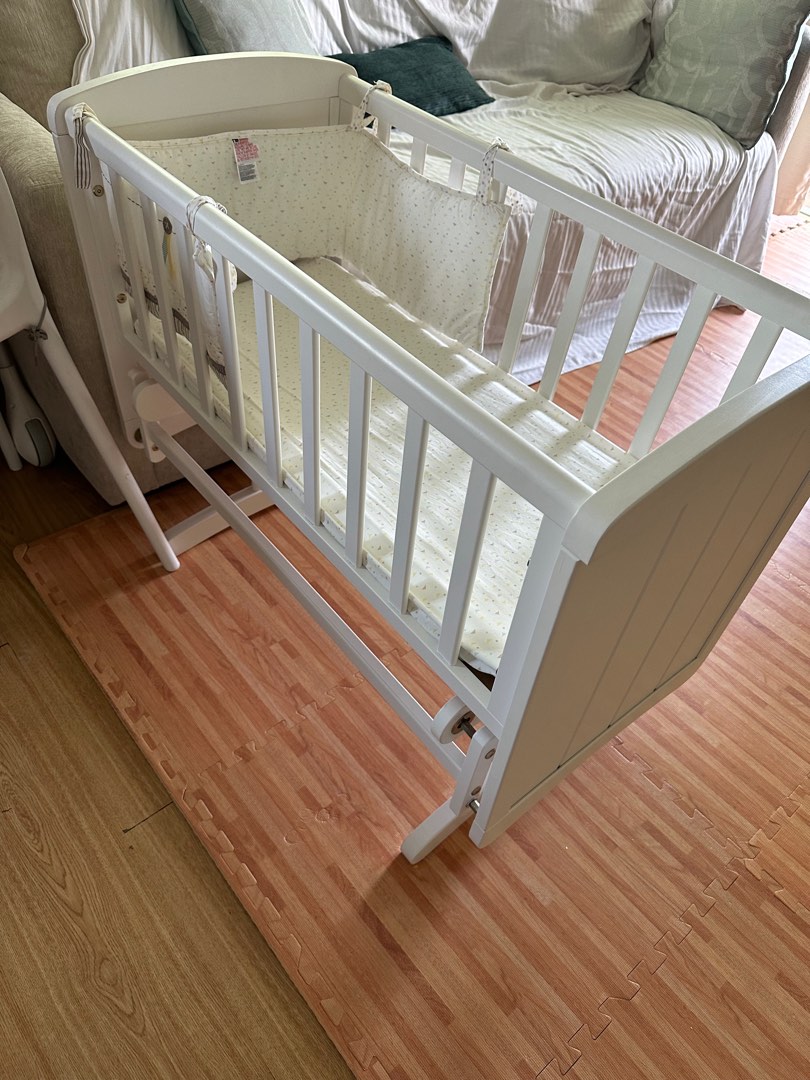 Wooden swinging crib on Carousell