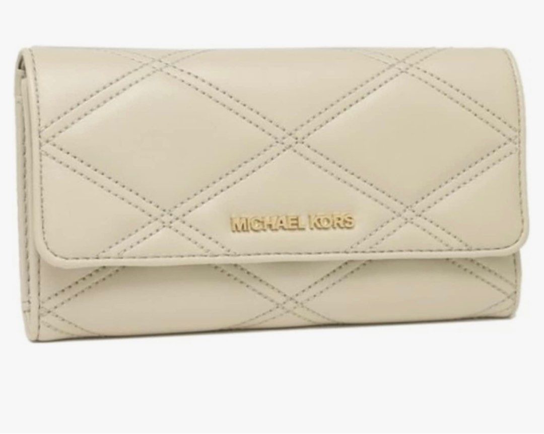 Michael Kors (Category: Luxury Bags & Wallets) located in Del Monte. Submitted by loryelletee (Listing ID 1221510684, Image 1). Description: Michael Kors Jet Set Travel Trifold Wallet Vegan Leather Color: Light Sand Brand new with tag 100% Authentic Fresh from U.S On hand Php: 3,200 Michael Kors Jet Set Travel Large Trifold Wallet Vegan Leather 7'' L x 4'' H x 1'' D Vegan material Interior: 1 Window ID, 4 Banknote Slots, 17 Credit Card Slots Pres