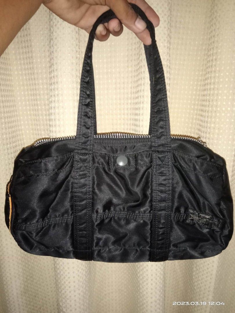PORTER (Category: Luxury Bags & Wallets) located in Pili. Submitted by alexsanandres412 (Listing ID 1221544014, Image 2). Description: Porter mini duffle bag good as sana.. issue: faller and ung tag nsa see last 2 pic..