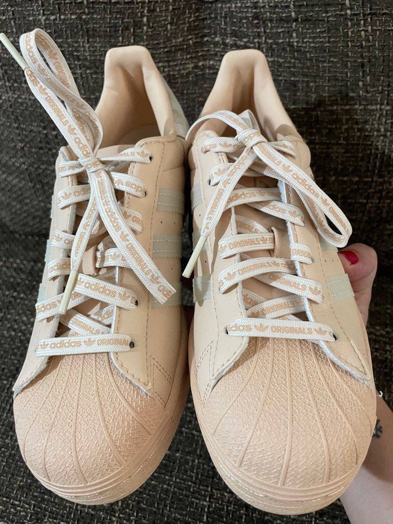 peach and white superstars