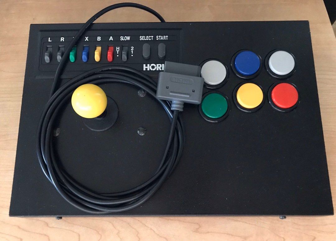 Hori Super Nintendo (Category: Controllers) located in San Juan City. Submitted by ethannate (Listing ID 1218257619, Image 1). Description: Hori Super Nintendo/Famicom (SNES/SFC) Fighting stick HSJ-12 (boxed not pictured).