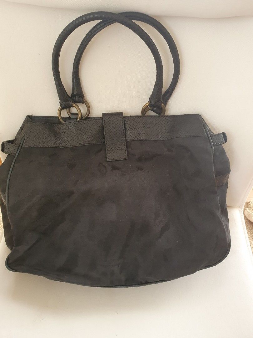 Just Cavalli black tote bag (Category: Tote Bags) located in Cebu City. Submitted by beebums (Listing ID 1218199153, Image 2). Description: pre owned.My personal bag. no inclusions. still very nice. metal tarnished, the rest of the bag still very good condition. see pictures for details. Original Just Cavalli Made in Italy.