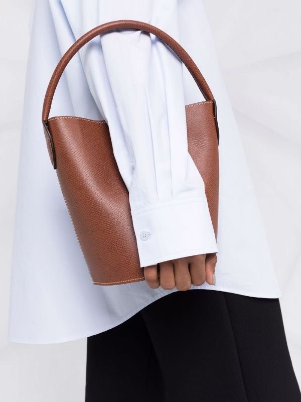 Longchamp on X: Rewriting the classics. The iconic leather of the  #LongchampEpure now has its very own bag: introducing the Epure bucket bag.   #LongchampSS22  / X