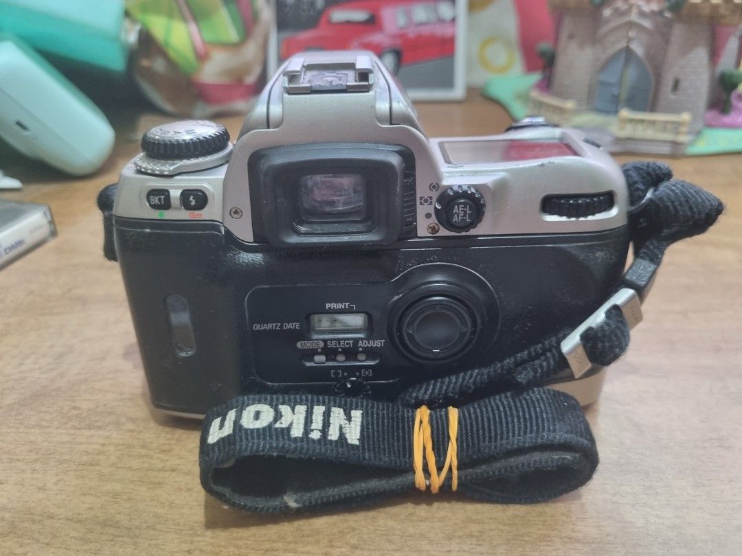 Nikon F80 film camera (Category: Cameras) located in Silang. Submitted by samflores2k4t7 (Listing ID 1218246934, Image 3). Description: For sale vintage Nikon F80 film camera With Nikon AF Nikmor 35-135mm lens made in Japan Good working condition tested with battery Not tested with film Issue battery cover hindi nalock pero nagamit nman see pix.