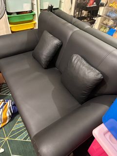 2-seater black couch with ottoman