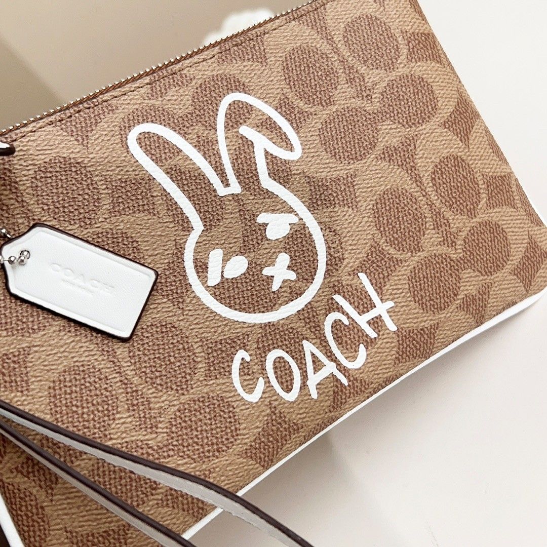 Coach Signature Logo Canvas Rabbit Wristlet, Women's Fashion, Bags ...