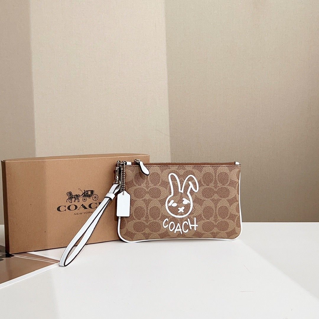 Coach Signature Logo Canvas Rabbit Wristlet, Women's Fashion, Bags ...