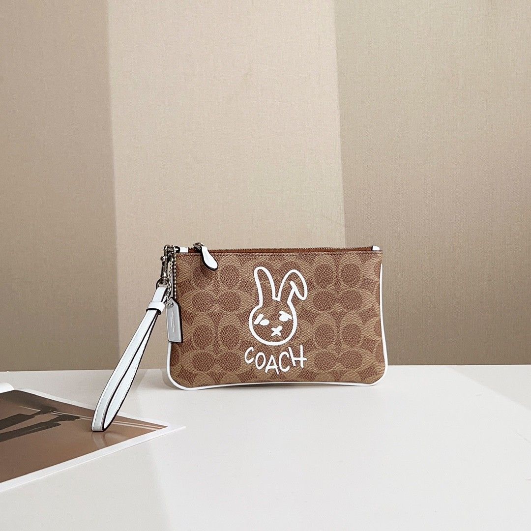Coach Signature Logo Canvas Rabbit Wristlet, Women's Fashion, Bags ...