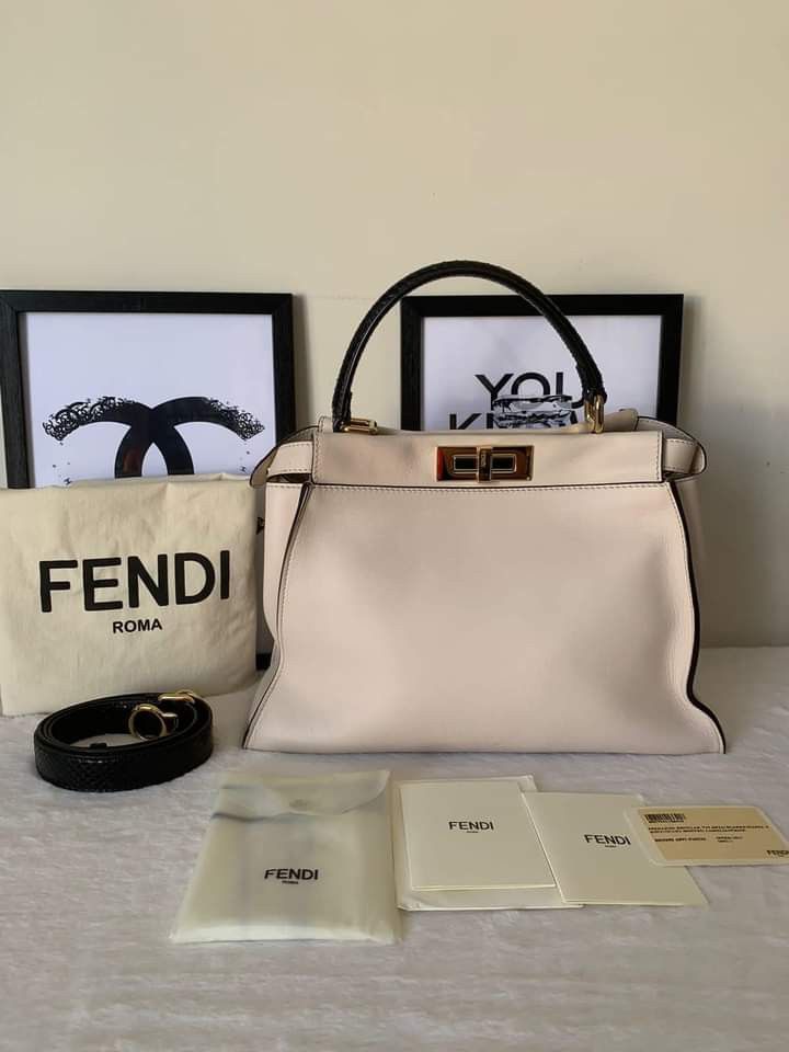 Fendi Peekaboo Medium w/ Monster Eyes Interior (Category: Luxury Bags & Wallets) located in Manila. Submitted by bagislifeshop (Listing ID 1221830920, Image 1). Description: ▪️Fendi Peekaboo Medium w/ Monster Eyes Interior￼ Bag▪️ ☑️Available in Pampanga ✅Condition: 8.8/10 ✅Material: Python leather, calf leather ✅Colour: Ivory in GHW, black python top handle ✅Inclusions: dustbag, raincoat, cards and python strap.