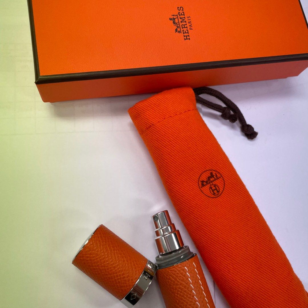 Hermes leather case refillable perfume bag spray. Orange Carousell