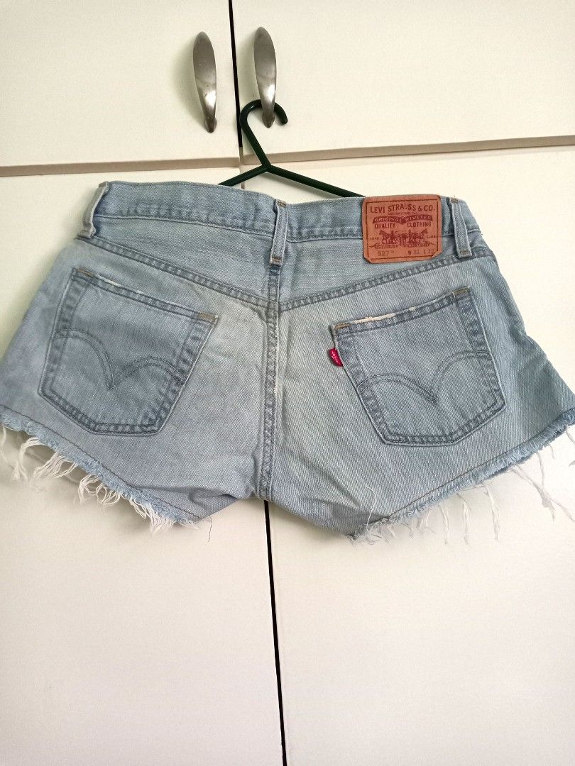 Levis 527 distressed shorts at Php250. No meet ups, Women's Fashion,  Bottoms, Shorts on Carousell