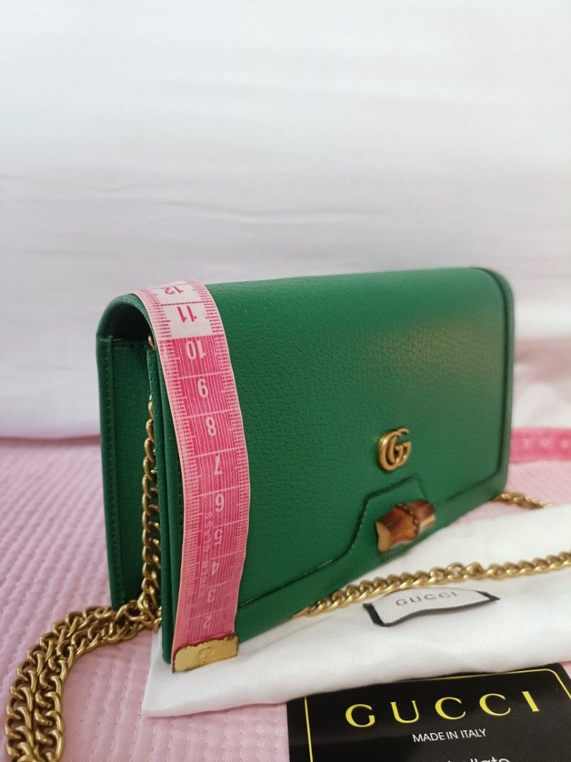Preloved Diana Mini Bag with Bamboo (Category: Luxury Bags & Wallets) located in Cebu City. Submitted by elcoleccion21 (Listing ID 1222050340, Image 3). Description: Japan Source bag Emerald green leather Antique gold-toned hardware Moiré and microfibre lining with suede-like finish Double G Bamboo detail Inside: 2 card slots and 1 hook Chain shoulder strap with 54cm drop Snap button closure.