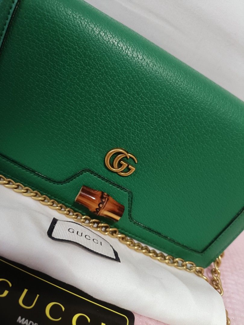 Preloved Diana Mini Bag with Bamboo (Category: Luxury Bags & Wallets) located in Cebu City. Submitted by elcoleccion21 (Listing ID 1222050340, Image 2). Description: Japan Source bag Emerald green leather Antique gold-toned hardware Moiré and microfibre lining with suede-like finish Double G Bamboo detail Inside: 2 card slots and 1 hook Chain shoulder strap with 54cm drop Snap button closure.