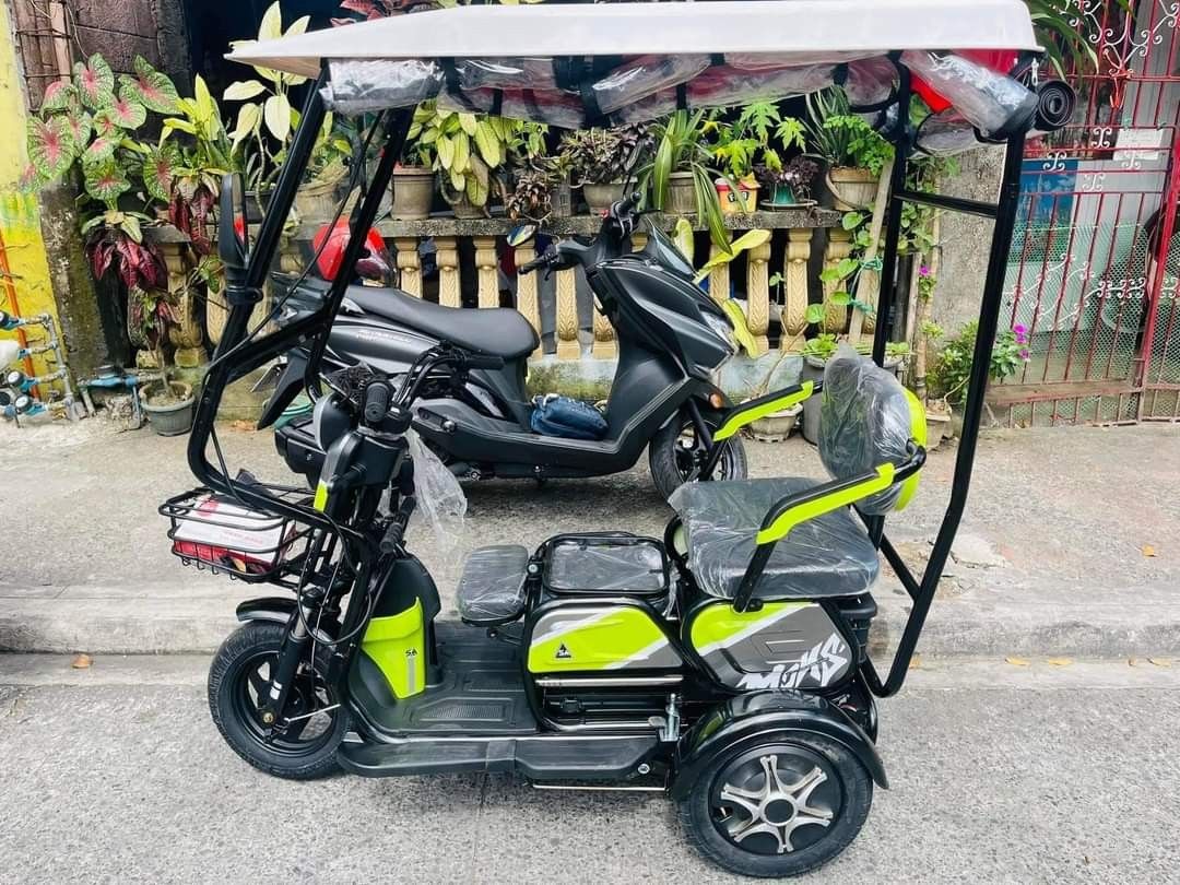 URANUS MINI 3 WHEELS E-TRIKE WITH ROOF & WINDSHIELD (Category: Bicycles) located in Pasig City. Submitted by gemma_00 (Listing ID 1222231687, Image 3). Description: RESTOCKED 😱😱😱 PINAKA MURANG ETRIKE, LUMAPAG NAAAA 🥰 URANUS MINI 3 WHEELS E-TRIKE WITH ROOF & WINDSHIELD ❗₱28,000 SALE PRICE 👉🏻FREE TRAPAL / RAIN CURTAIN 📌Specs ✔️WITH AUTOMATIC WIPER ✔️WITH ROOF & WINDSHIELD ✔️WITH SIDEMIRROR ✔️TIRE SIZE 10X3.0 ✔️WITH REAR BASKET ✔️3 SEATER WIT