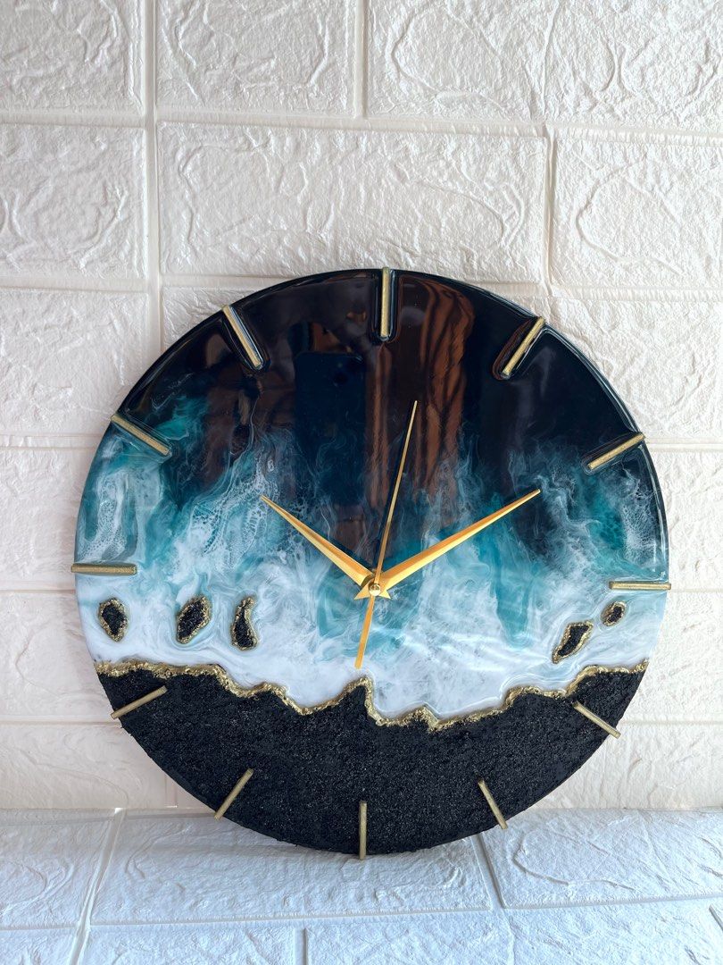 wall clock (Category: Clocks) located in Singapore. Submitted by gee68 (Listing ID 1222176830, Image 1). Description: Resin art seascape wall clock with texture in black and white with golden hands size: 30cm diameter the clock is made with resin and pigments on wood panel embellished with glass crystals ..its a beautiful piece of art other needle options available can be made with silver hands & other colors too preorder...ready in 3-4 days cloc