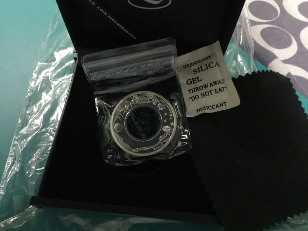“2012” Opal silver Proof Coin Aus, Perth Koala series Mint (Category: Currency) located in Del Monte. Submitted by bernapi63 (Listing ID 1222417977, Image 3). Description: “2012 “ Australian Black Opal Series Koala 1 oz proof coin limited edition Silver coin (31.104 +grams) weight .9999 fineness “Proof Coin” In plastic protective /blue box included/in very good condition Brilliant Uncirculated .