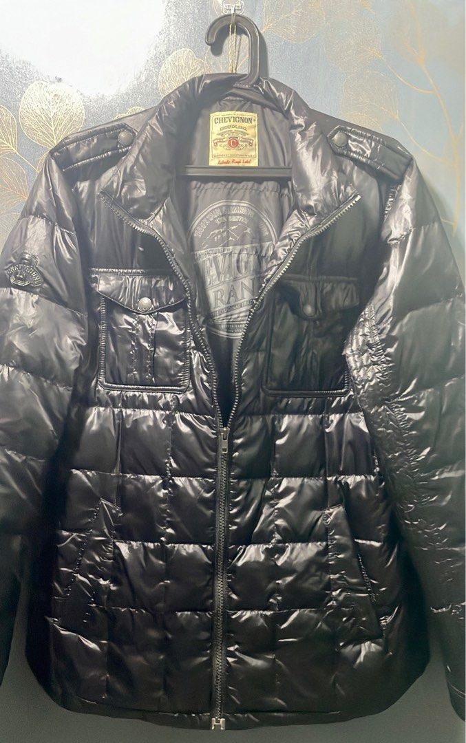 Black Puffer Jacket (Category: Coats, Jackets and Outerwear) located in Taguig. Submitted by kengarcia.0407 (Listing ID 1222410025, Image 2). Description: Chevignon black puffer Jacket (Vintage) (Authentic) Width20 L29 Cloth/Color Rate - 9.5/10 Size: XL on Tag but fits L frame Very Good condition RFS: Decluttering.