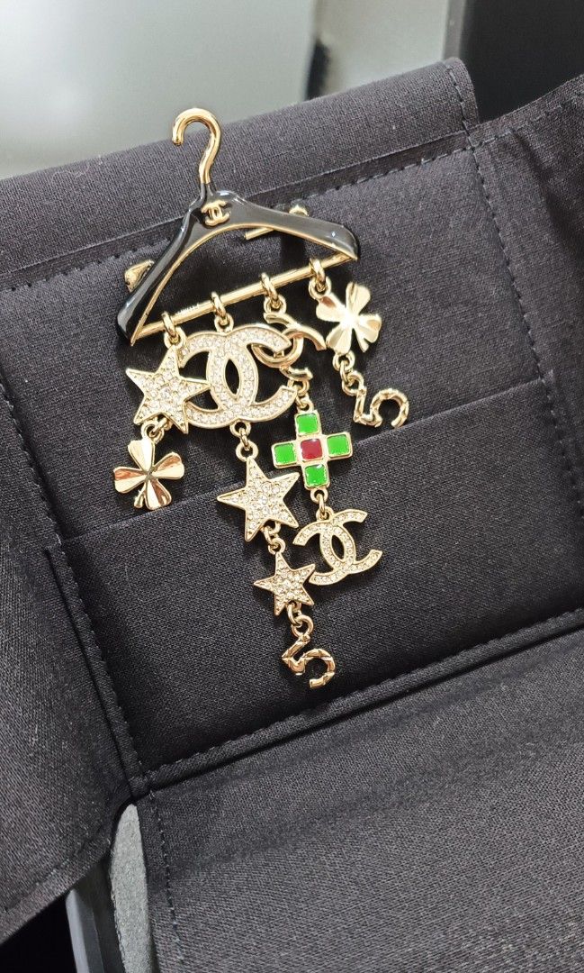 NOV Sale Authentic Chanel Brooch (Category: Luxury Accessories) located in Paranaque City. Submitted by par18 (Listing ID 1222524506, Image 2). Description: 2023 Metal, Strass & ResinGold, Crystal, Black, Green & Red Pre-owned used Brooch by CHANEL in good condition..