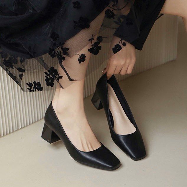 Black square heel pumps top