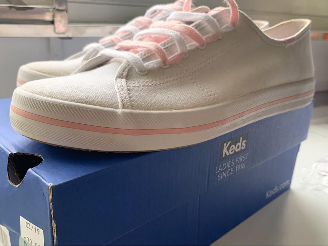White shoes store with pink shoelaces