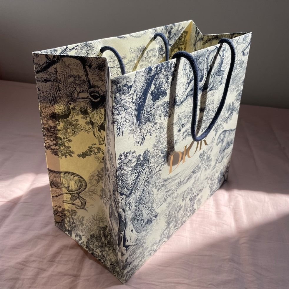 Authentic Dior Paper Bag with Blue (Category: Luxury Accessories) located in Makati City. Submitted by carlosf34941 (Listing ID 1222613224, Image 1). Description: Christian Dior Paper Bag Merari Edition Size: 12" x 12" x 6".
