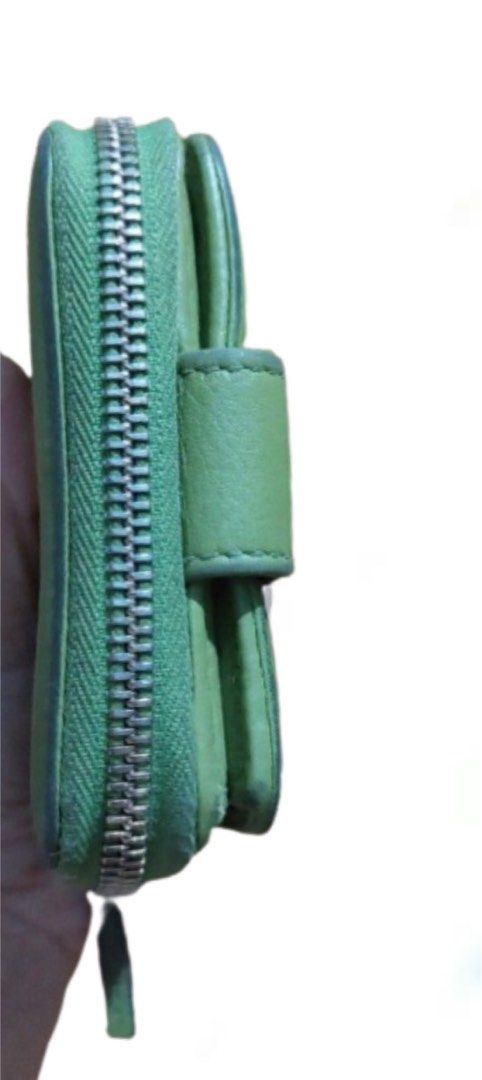 Authentic Gucci French Flap Small Compact Wallet (Category: Luxury Bags & Wallets) located in Quezon City. Submitted by msiscloset (Listing ID 1222665897, Image 3). Description: NEGOTIABLE! Gucci leather wallet in apple green with 8 card holder slots with snap closure, one bill compartment, and separate zipper coin compartment. Coded With signs of use since it’s no longer brand new With rubs on exterior but can be repainted by a professional rest