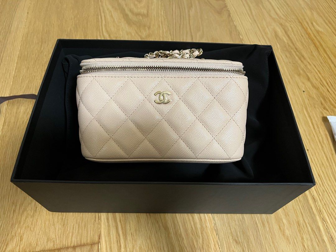 Chanel rectangular vanity case (beige) (Category: Bags & Wallets) located in Singapore. Submitted by shop.shop.shopping (Listing ID 1222723948, Image 1). Description: Used only twice Really too small for my liking and hence letting it out. Full set with original local MBS receipt Authenticity card available as well Caviar, beige, light gold hardware .