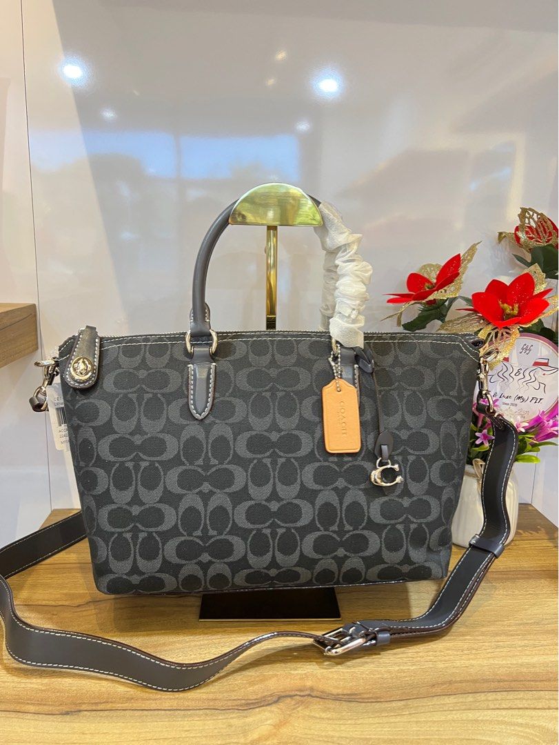 Cara'sGlossy Glide satchel bags