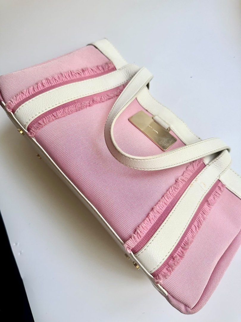 Kate Spade Pink and White Handbag (Category: Luxury Bags & Wallets) located in Makati City. Submitted by bea_anne_13 (Listing ID 1222656872, Image 3). Description: GUARANTEED AUTHENTIC Kate Spade bag. I don’t sell fakes. Info: - authentic Kate Spade bag - bag is in good condition except for some discoloration as shown in the photo - inside is still very clean - RFS: decluttering - perfect for summer, and very on-trend bag Inclusions: - bag - dust