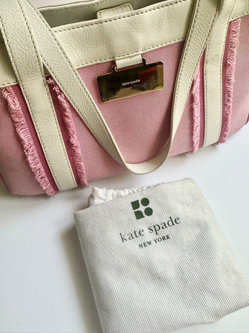 Kate Spade Pink and White Handbag (Category: Luxury Bags & Wallets) located in Makati City. Submitted by bea_anne_13 (Listing ID 1222656872, Image 2). Description: GUARANTEED AUTHENTIC Kate Spade bag. I don’t sell fakes. Info: - authentic Kate Spade bag - bag is in good condition except for some discoloration as shown in the photo - inside is still very clean - RFS: decluttering - perfect for summer, and very on-trend bag Inclusions: - bag - dust