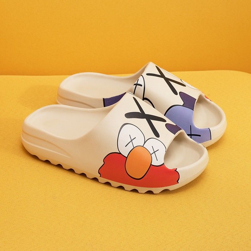 slides kaws