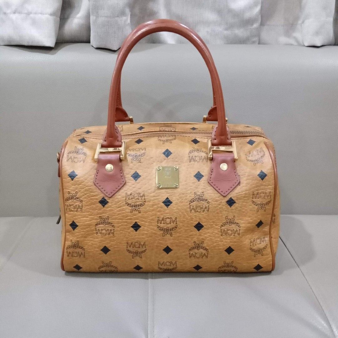 MCM Cognac Bandouliere Type (Category: Luxury Bags & Wallets) located in Taguig. Submitted by esa.agustin (Listing ID 1222648467, Image 2). Description: Original MCM cognac bandouliere type bag. Size 25 cm. With dust bag and original strap. Made in Germany.