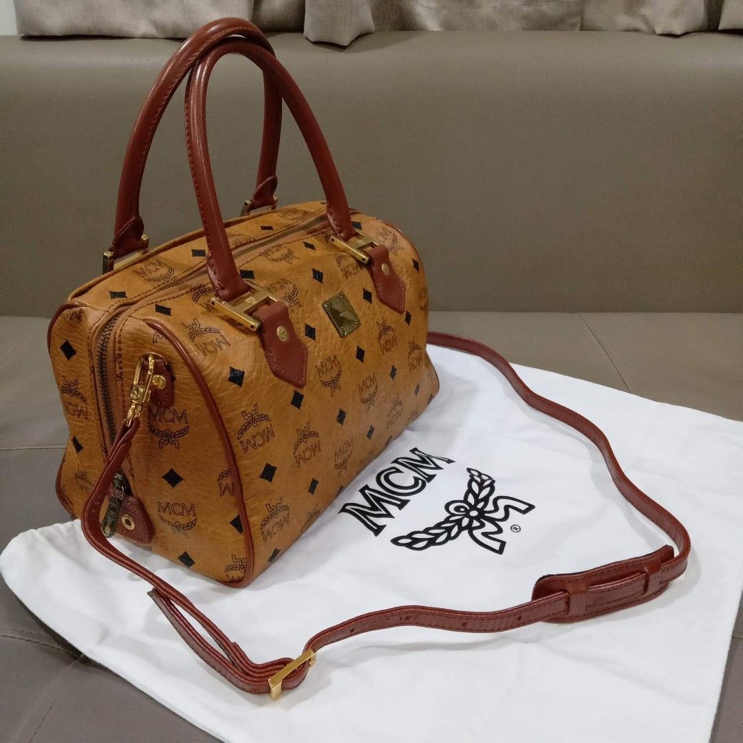 MCM Cognac Bandouliere Type (Category: Luxury Bags & Wallets) located in Taguig. Submitted by esa.agustin (Listing ID 1222648467, Image 1). Description: Original MCM cognac bandouliere type bag. Size 25 cm. With dust bag and original strap. Made in Germany.