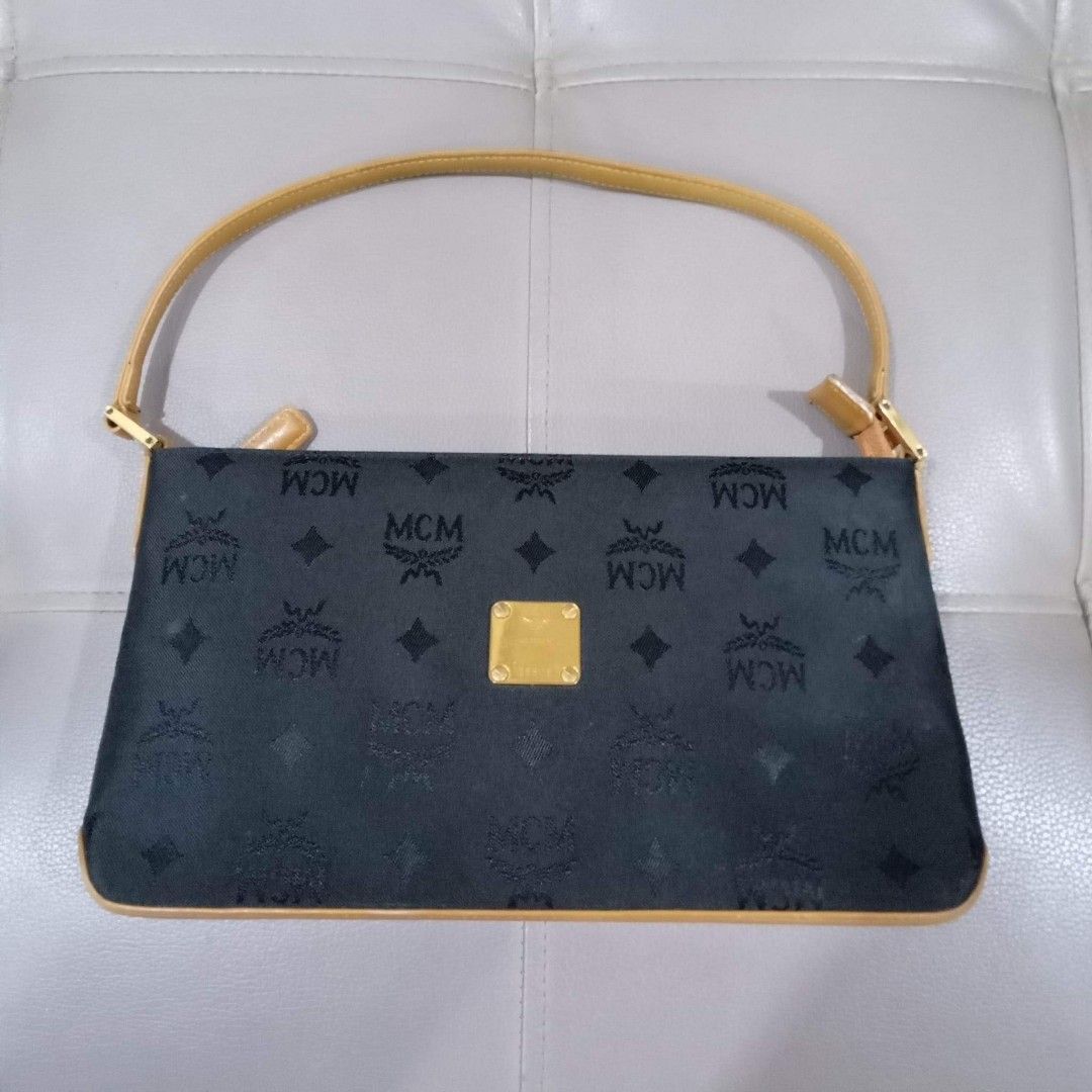 MCM Pochette Type (Category: Luxury Bags & Wallets) located in Taguig. Submitted by esa.agustin (Listing ID 1222646781, Image 1). Description: Original MCM black canvas and leather combination pochette type bag. Made in Germany..