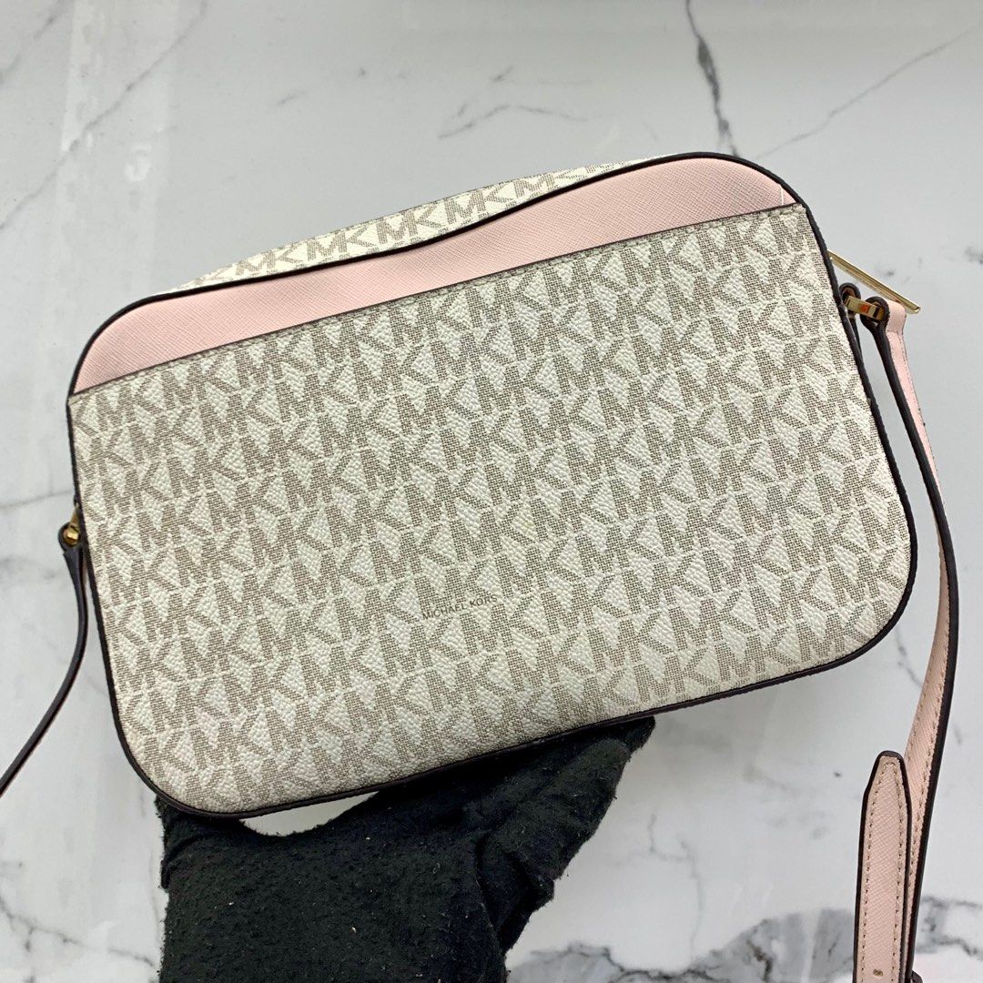 Pink and white hotsell michael kors purse