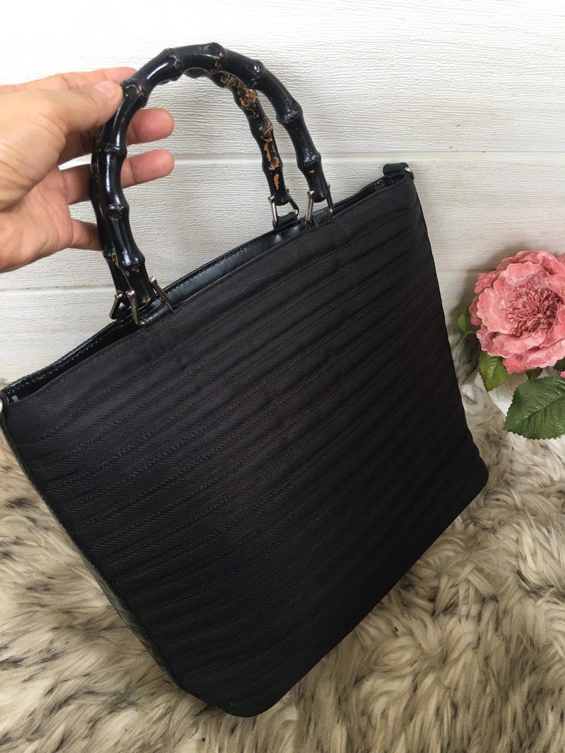Vintage GUCCI with bamboo handle (Category: Luxury Bags & Wallets) located in Tagum. Submitted by ynez.luxurypicksph (Listing ID 1222636191, Image 2). Description: Preloved Japan Medium Lacking sling strap Still pretty but please check handle for the flaw (color).