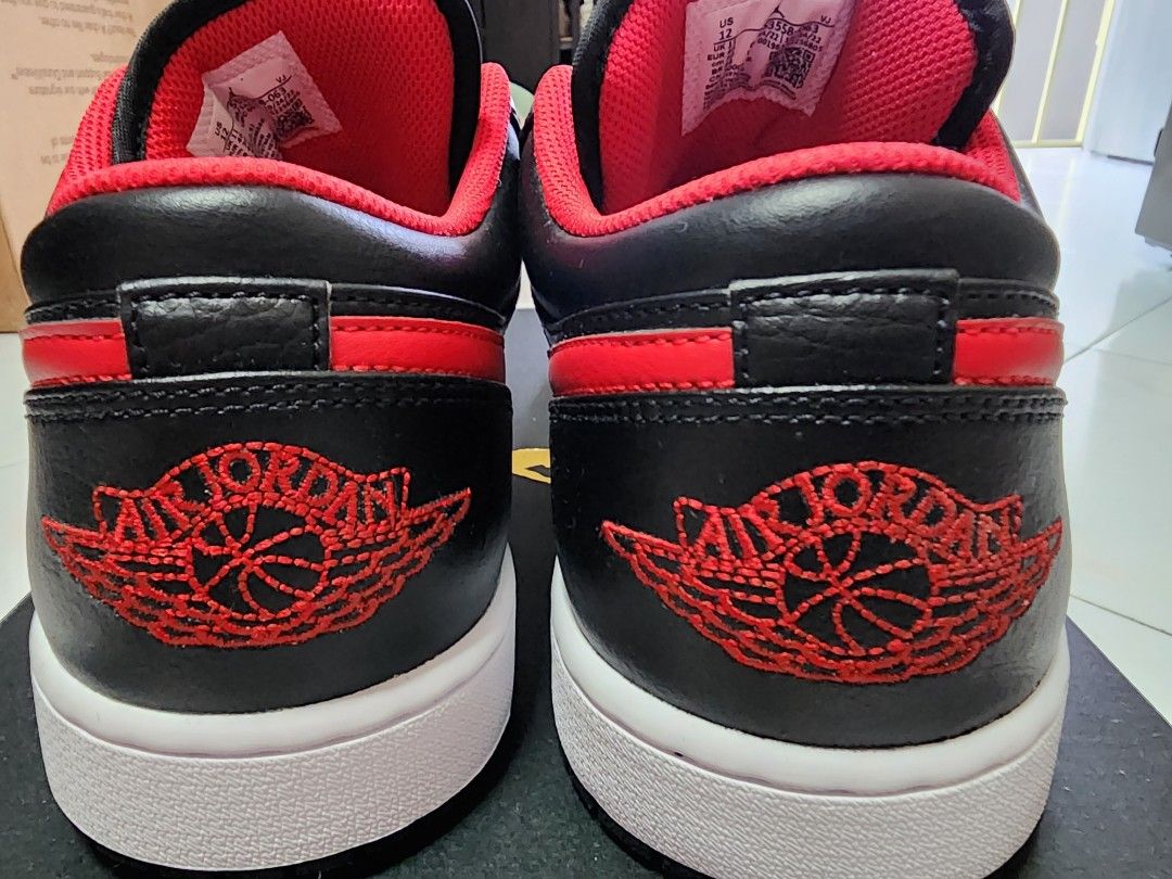 Low top black and red jordans store