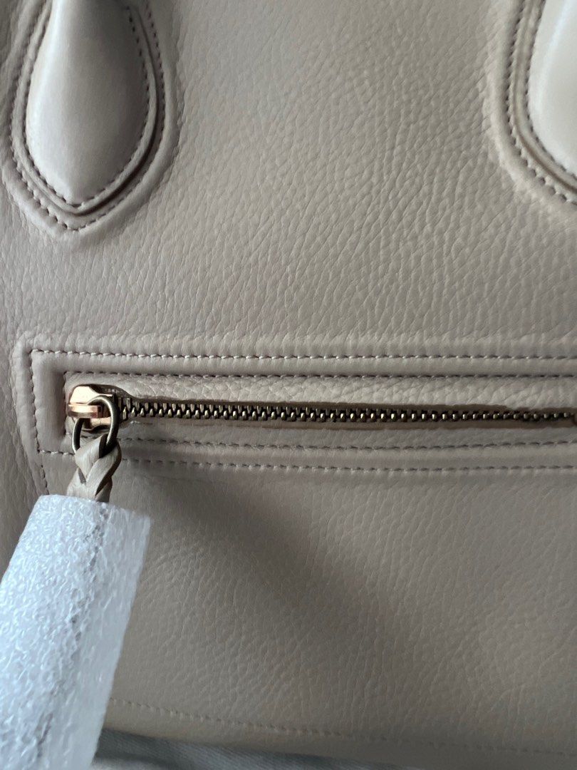 Like NEW Celine Medium Phantom in Dune Grained Calfskin (Category: Luxury Bags & Wallets) located in Marikina City. Submitted by caseykace (Listing ID 1222905851, Image 3). Description: The Medium Celine Phantom measures at 11"' H X 12" W x 10" D. It has a 5-inch handle drop and be carried by hand or on the arm. The Medium Celine Phantom fits folders and large envelopes. Bought for $3,400 in NYC. Peice still negotiable. Just stored, used once. A 