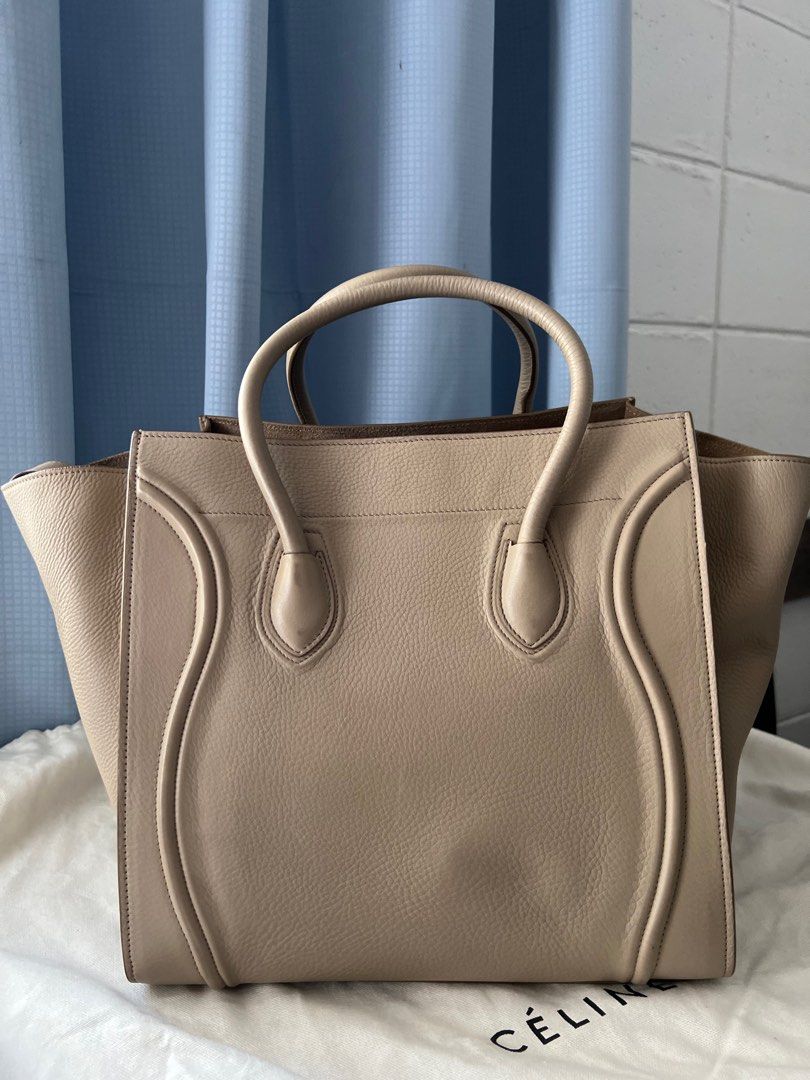 Like NEW Celine Medium Phantom in Dune Grained Calfskin (Category: Luxury Bags & Wallets) located in Marikina City. Submitted by caseykace (Listing ID 1222905851, Image 2). Description: The Medium Celine Phantom measures at 11"' H X 12" W x 10" D. It has a 5-inch handle drop and be carried by hand or on the arm. The Medium Celine Phantom fits folders and large envelopes. Bought for $3,400 in NYC. Peice still negotiable. Just stored, used once. A 